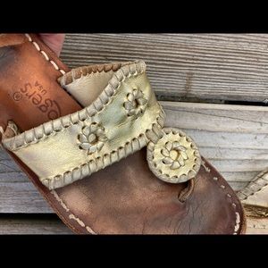 Well loved and broken-in Jack Rogers in gold.